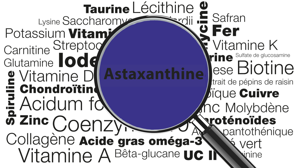 Divers termes de micronutriments et une loupe avec le mot astaxanthine